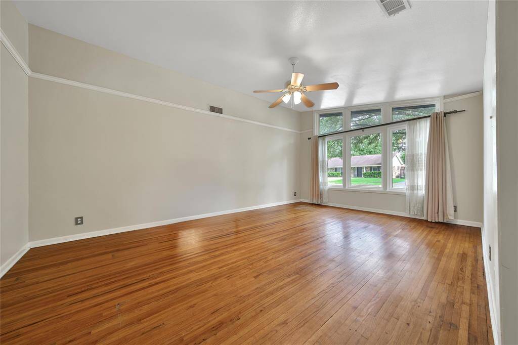 Spacious formal living area with high ceilings.