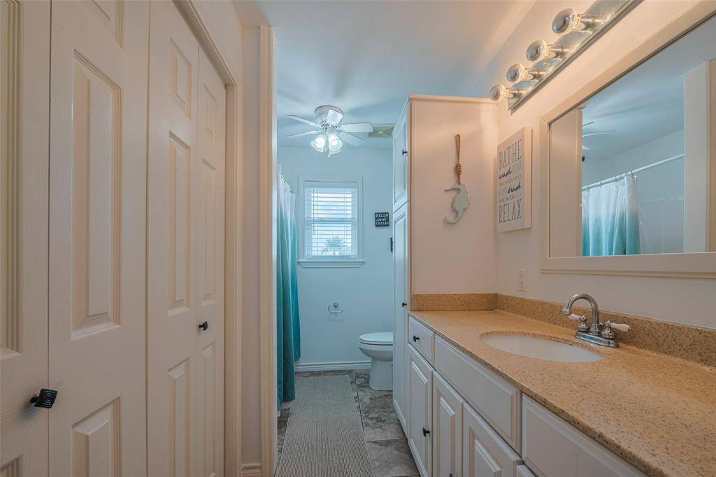 Spacious guest bathroom with ample counter space and even more space for storage and organization!