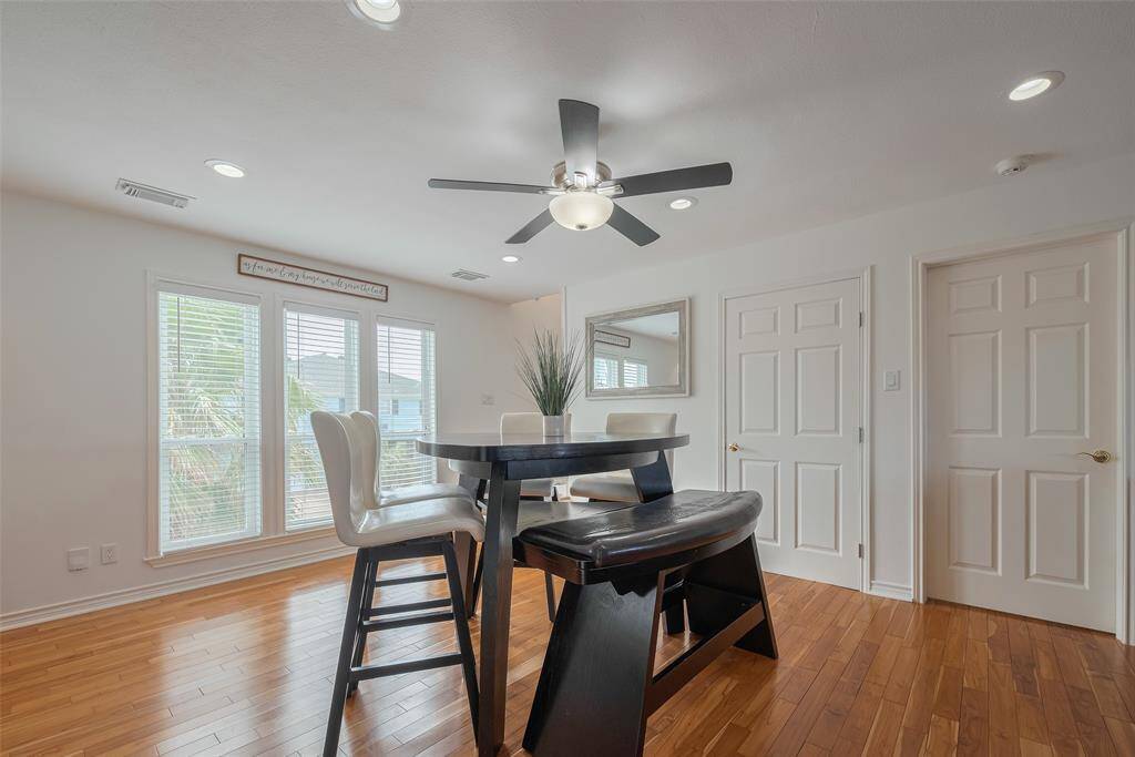 Spacious dining area! The laundry room is tucked away behind the door for easy access and convenience.