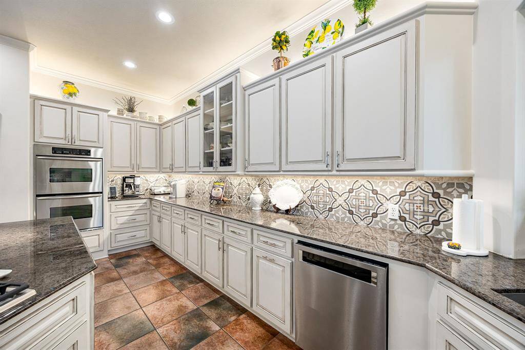 The kitchen has tons of cabinets with under and above cabinet lightening