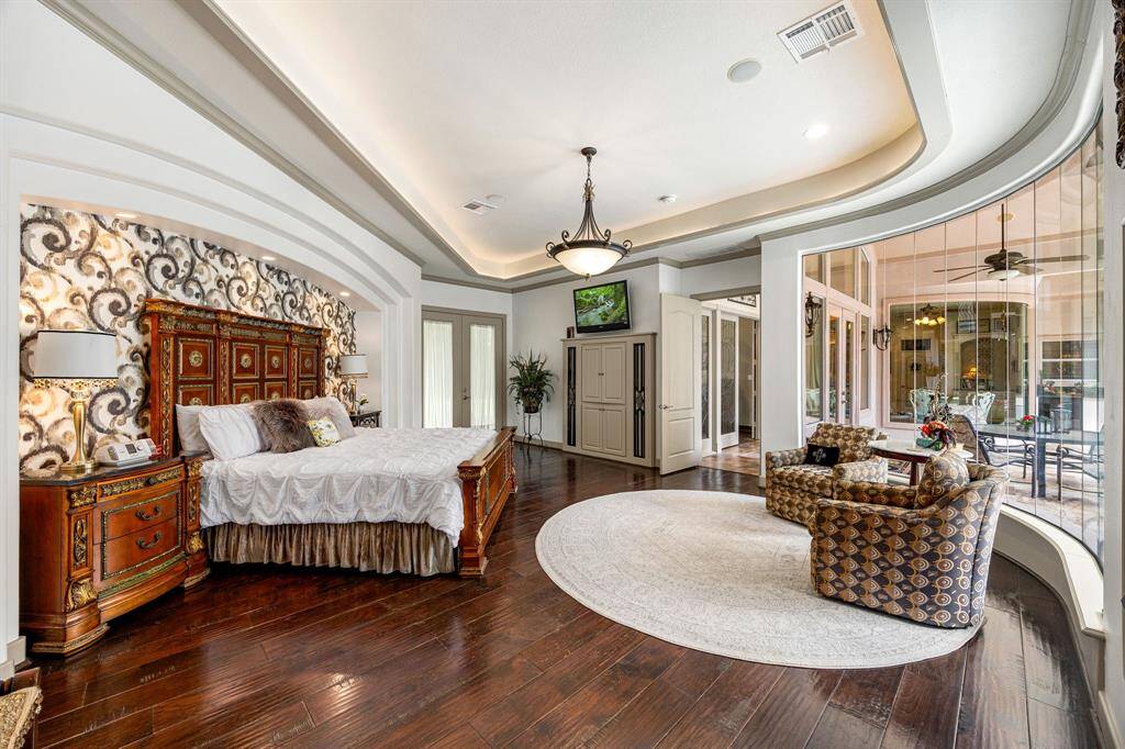 The primary suite offers private access to the backyard — a seamless blend of indoor comfort and outdoor living. Every detail has been thoughtfully designed