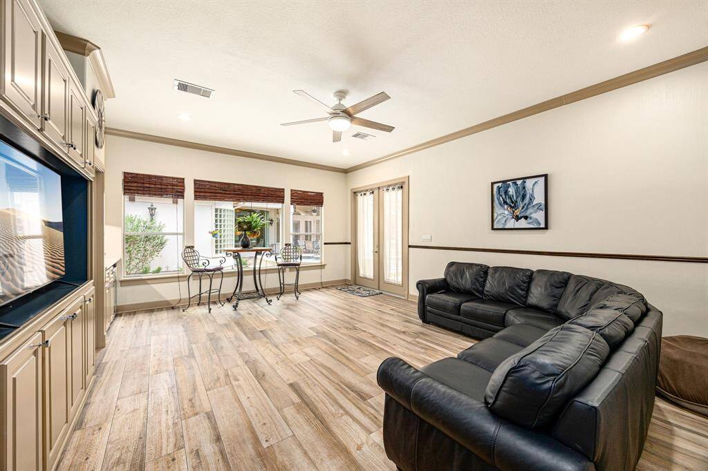 View of the downstairs cabana house that is equipped with a full bathroom and sink kitchenette area