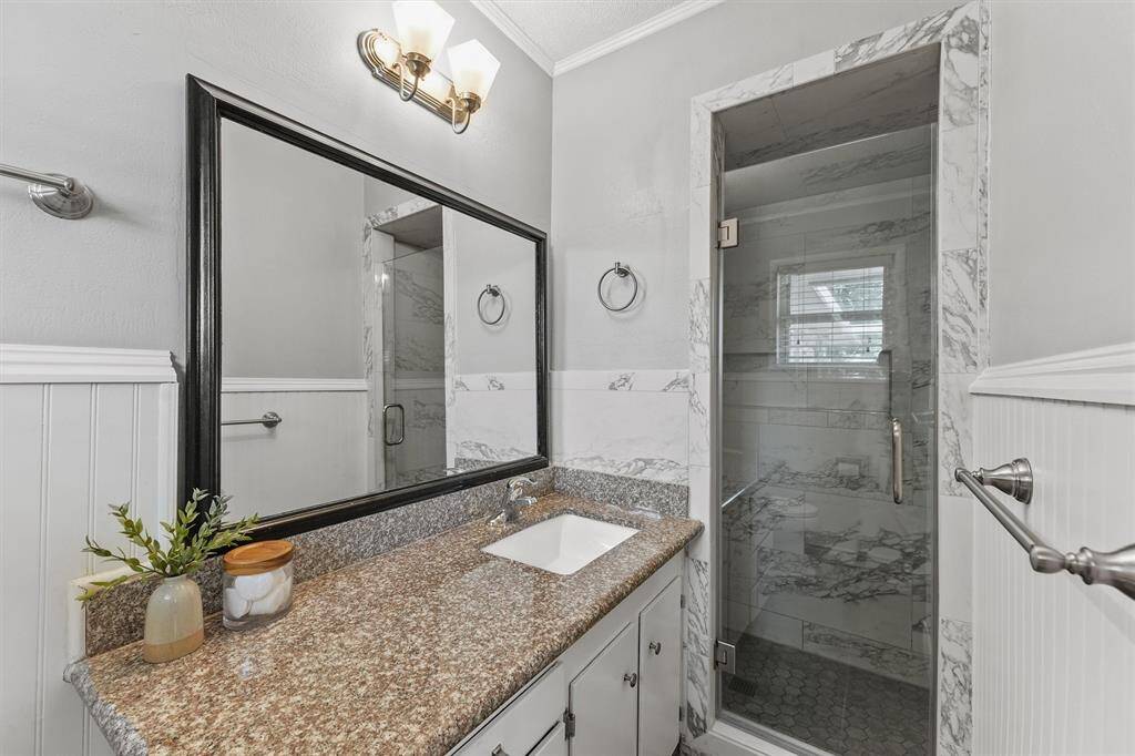 Primary bathroom with recently remodeled shower