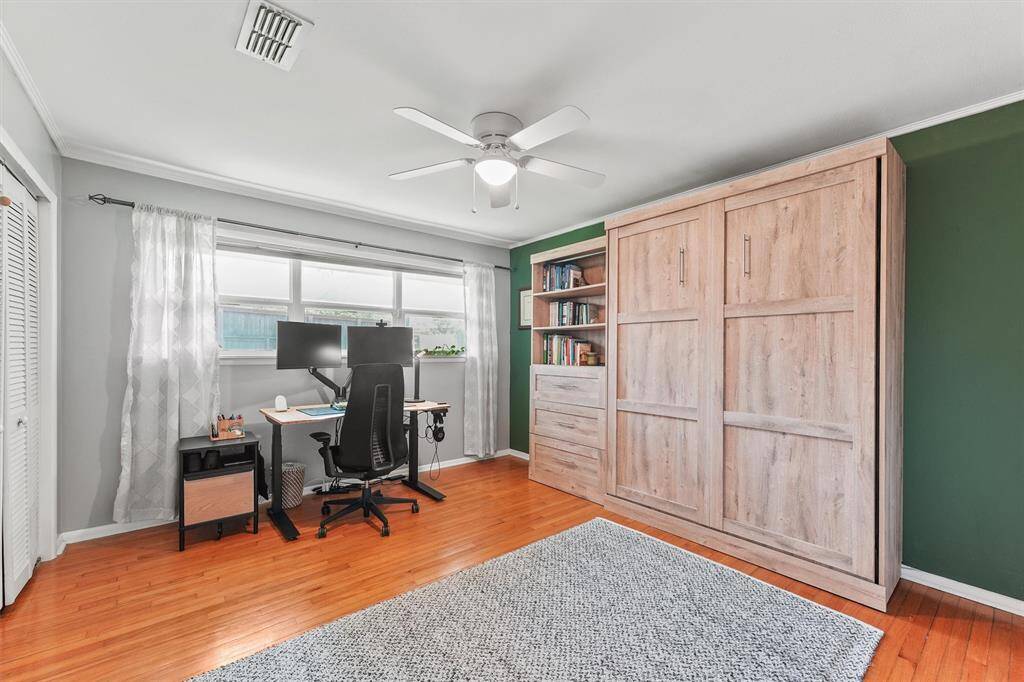 Secondary bedroom used as an office/guest room.  The murphy bed can stay with the home.
