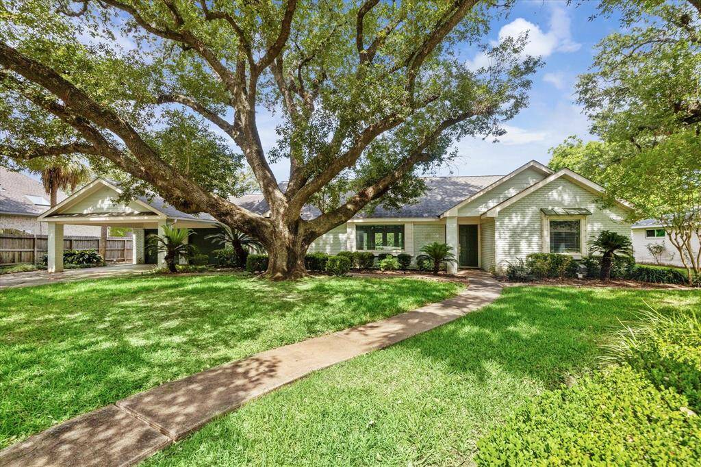 The tree shaded, generous front yard is complemented by a two-car garage and a two-car carport. You'll appreciate a shady spot for your car and the family on a hot day.