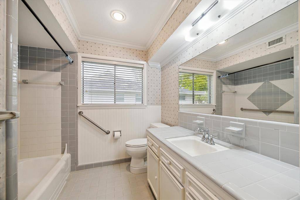 Bathroom #1 is located in the hallway, shared by bedrooms 1 and 2.