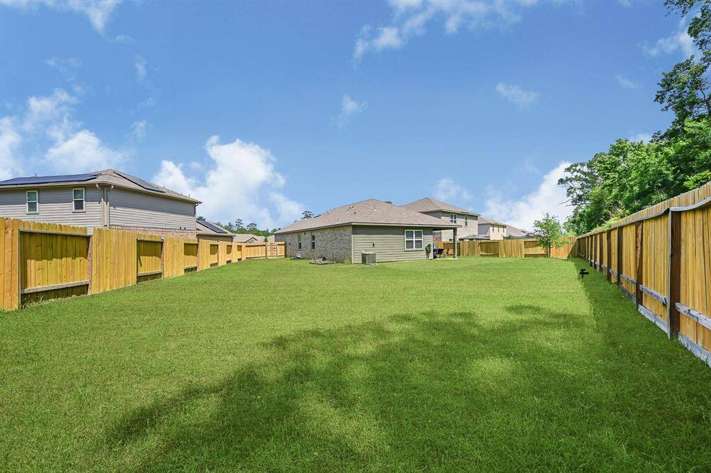 The oversized backyard has plenty of room for a garden, swingset, pretty much anything you can dream of!
