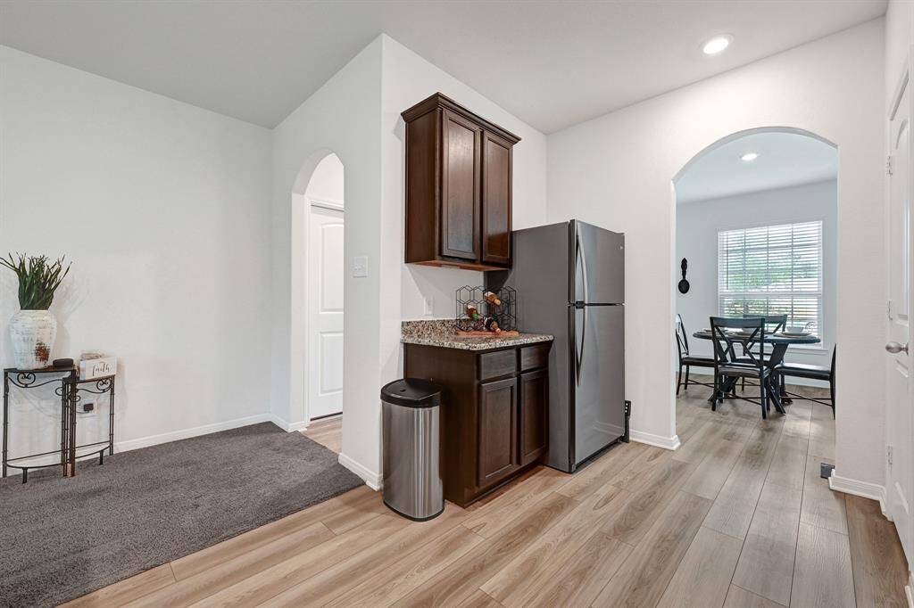 The additional counter space beside the fridge is the perfect unloading zone after a grocery trip.