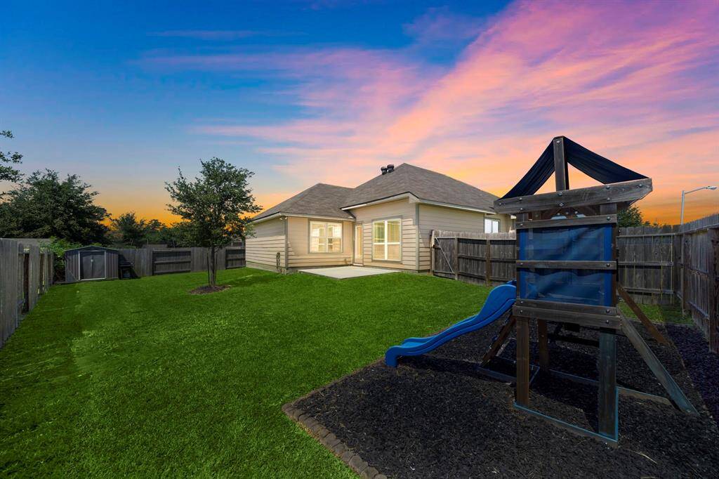 Enjoy a spacious, fully fenced backyard ideal for entertaining or outdoor activities, complete with a patio and dedicated play area. Corner lot location provides added privacy and ample space, making it a standout feature for relaxing or gathering with friends.