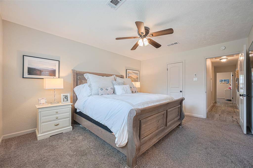 Tucked away at the back of the home, the spacious primary bedroom offers privacy and comfort and ample space for your dream furnishings. The walk-in closet provides excellent storage with both hanging space and built-in shelving.