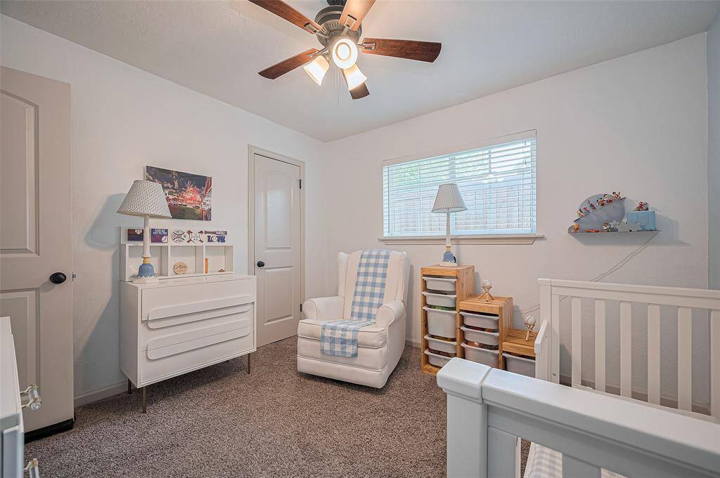 Here’s a look at another spacious secondary bedroom—offering comfort, versatility, and natural light.