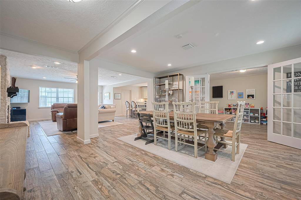 The open dining area offers ample seating and generous space for a buffet and display cabinet—perfect for both everyday meals and special gatherings.
