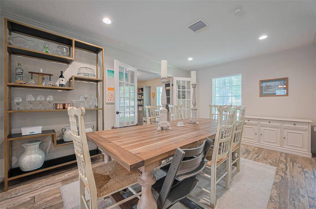 This alternate view of the dining room highlights the natural light pouring in from the large window at the front of the home.
