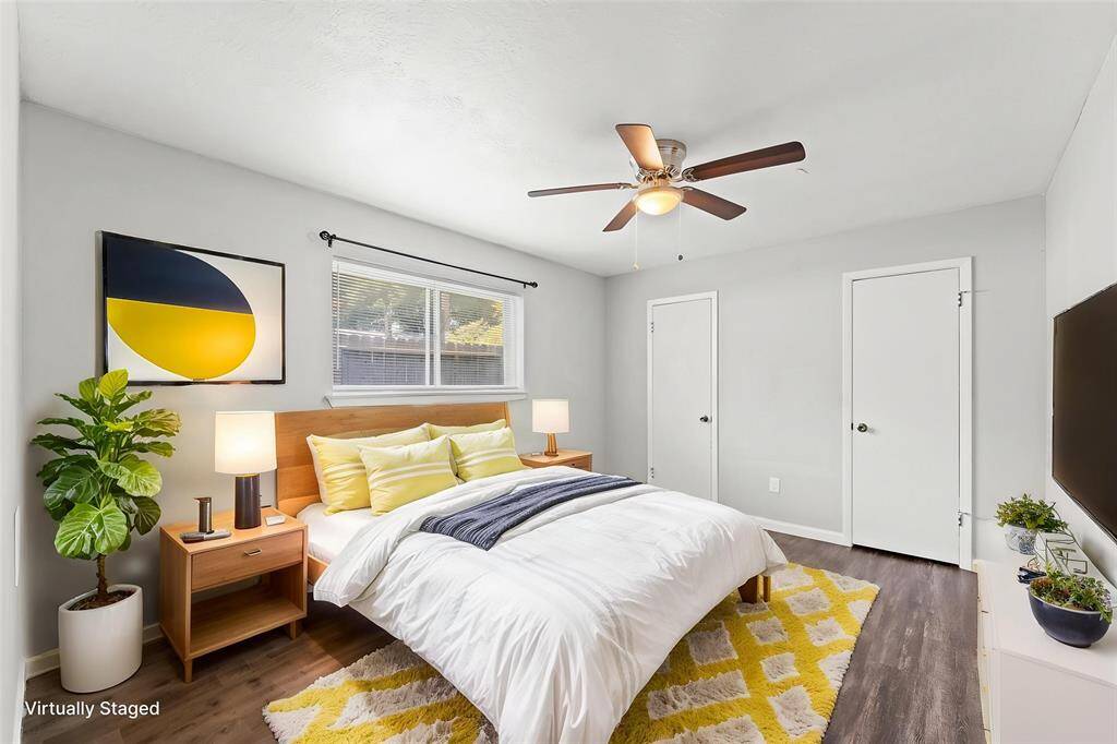 Virtually staged in this view, Bedroom 3 could hold a king-sized bed or two twins in addition to other furniture.