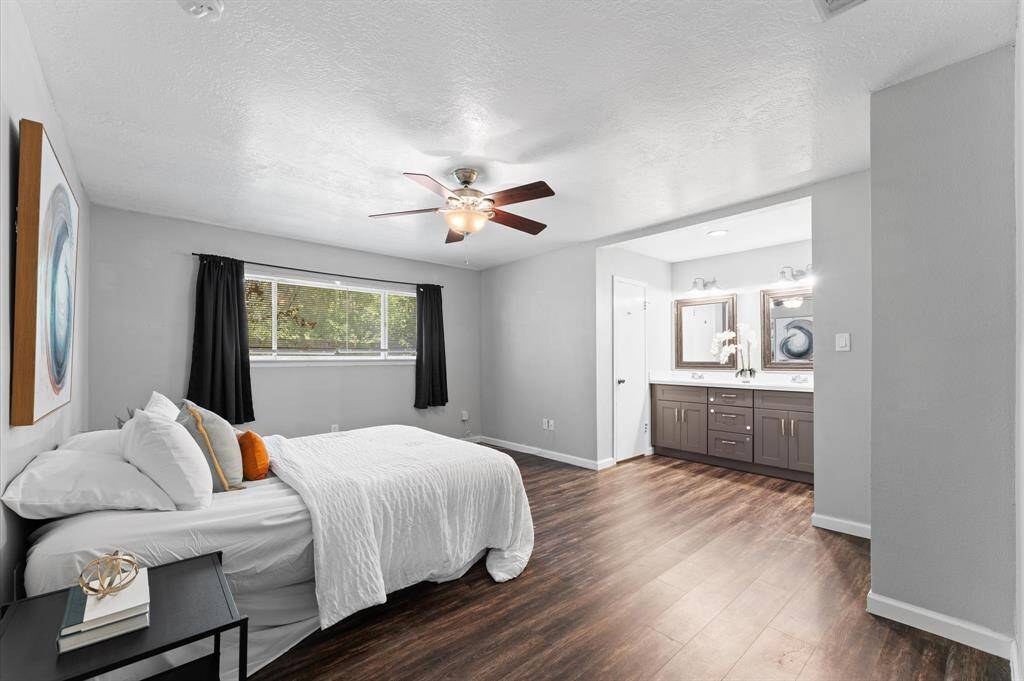 Step inside this spacious primary suite located separate from the secondary bedrooms. An open vanity separates the bathroom and walk-in closet.
