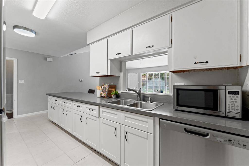 Looking from the kitchen pass-through toward the living room, you'll enjoy keeping up with the conversation while preparing your favorite meals.