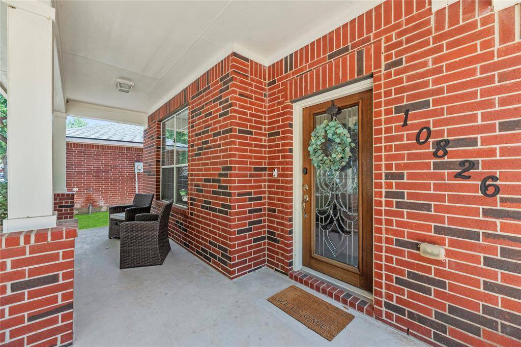Covered front patio, perfect place to enjoy Texas weather.