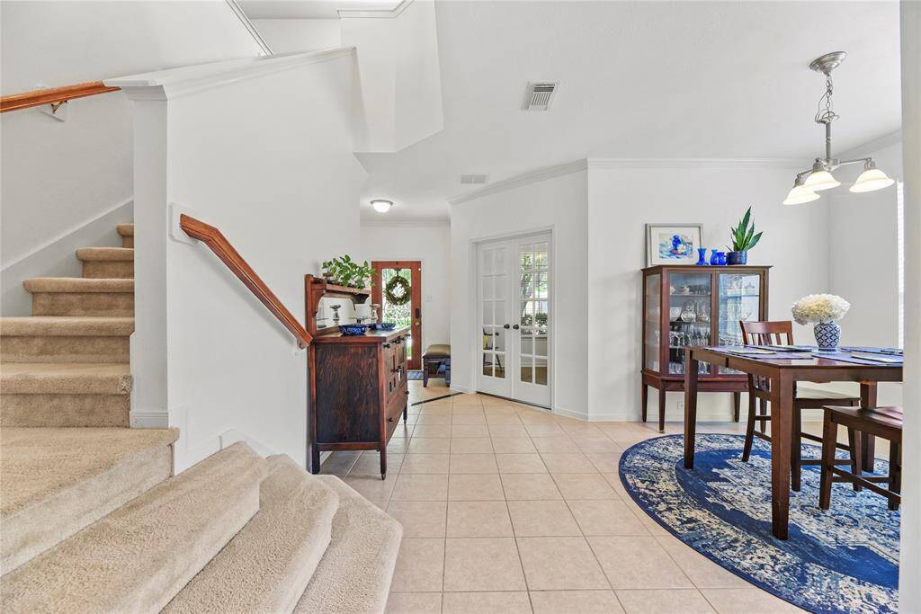 French Doors showcase the home office with new luxury vinyl plank flooring.