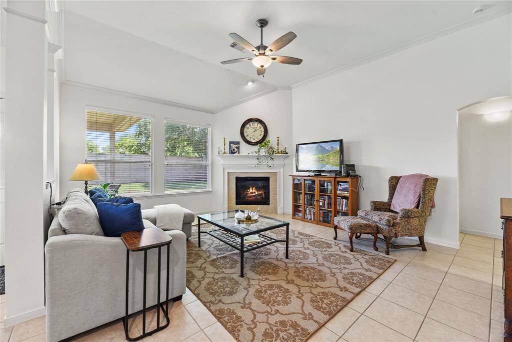 Living Area featuring vaulted ceilings and a fireplace.