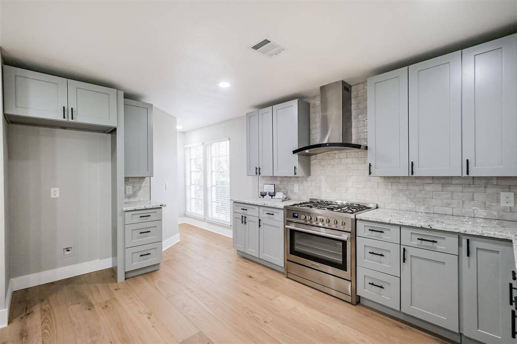 This kitchen is for a true gourmet. The soft closing cabinets and drawers provide plenty of storage and the stainless steel appliances are sure to impress the most discerning chef.