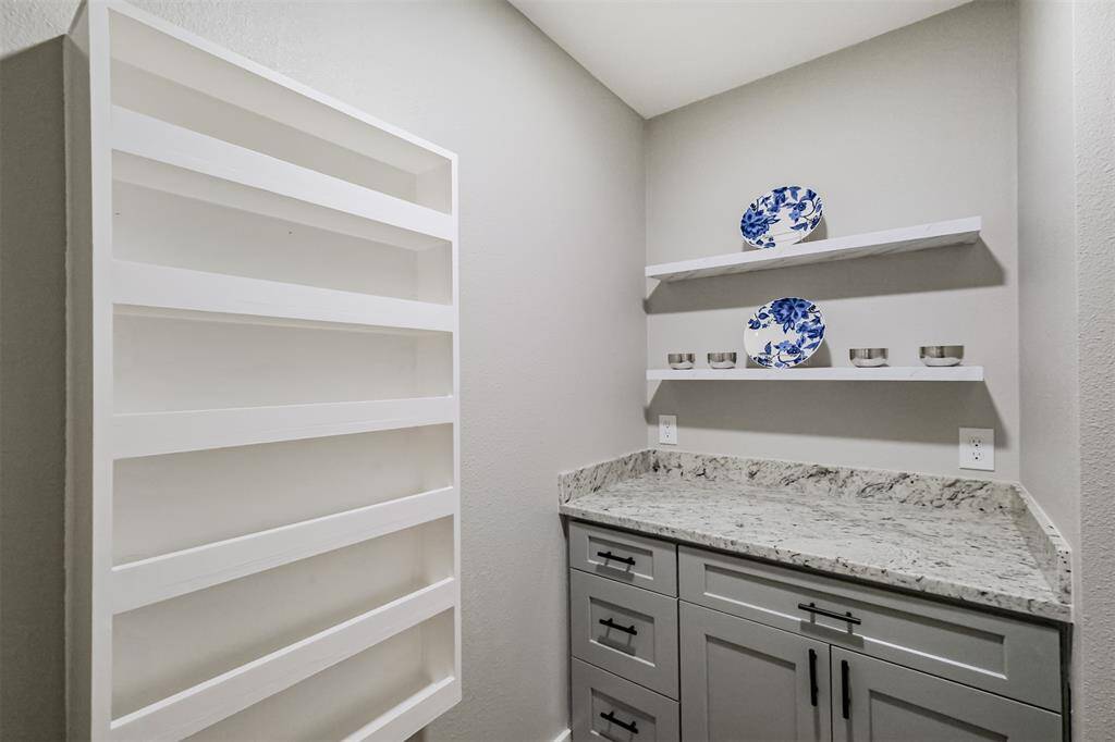 Just when you thought this room couln't get any better, you find additional storage and a space perfectly made for a coffee bar, prep area or whatever you can dream up.