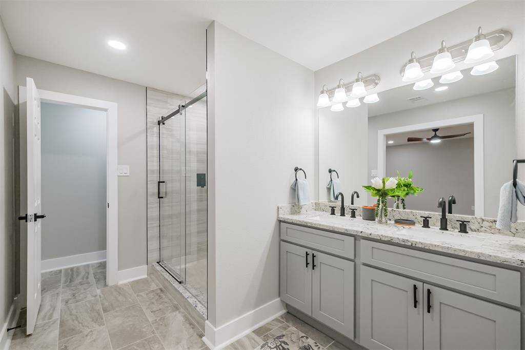 A suite isn't complete without a spa, and this one is sure to impress. The shower and toilette are tucked conveniently behind a privacy wall.