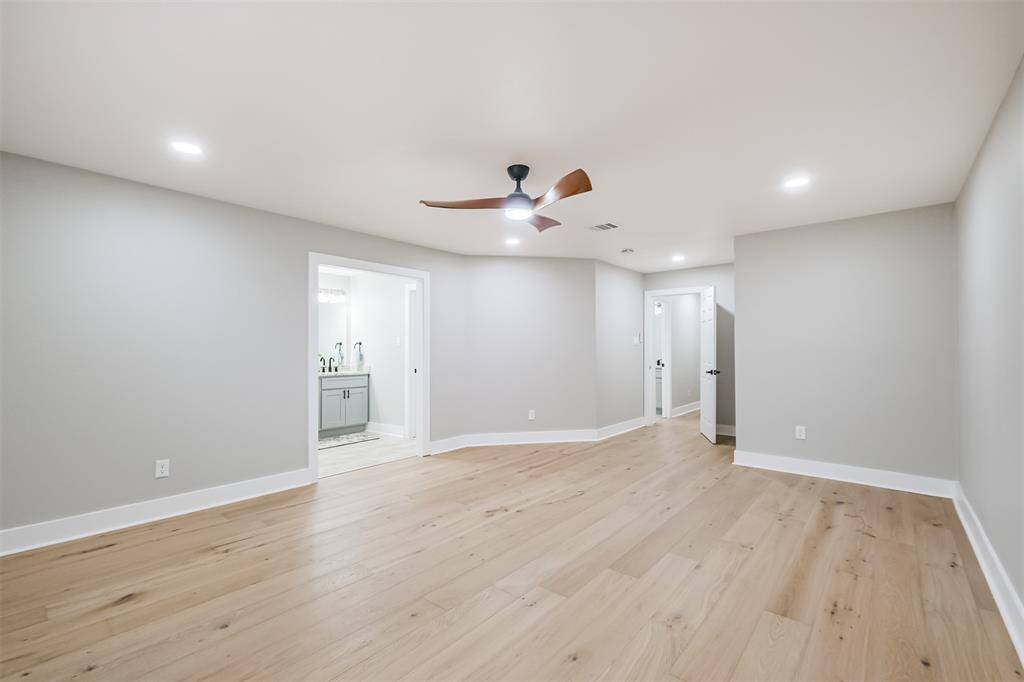 The view from the back of this room truly highlights the size of the room. Let's head back to the front of the home to see the rest of the private rooms.