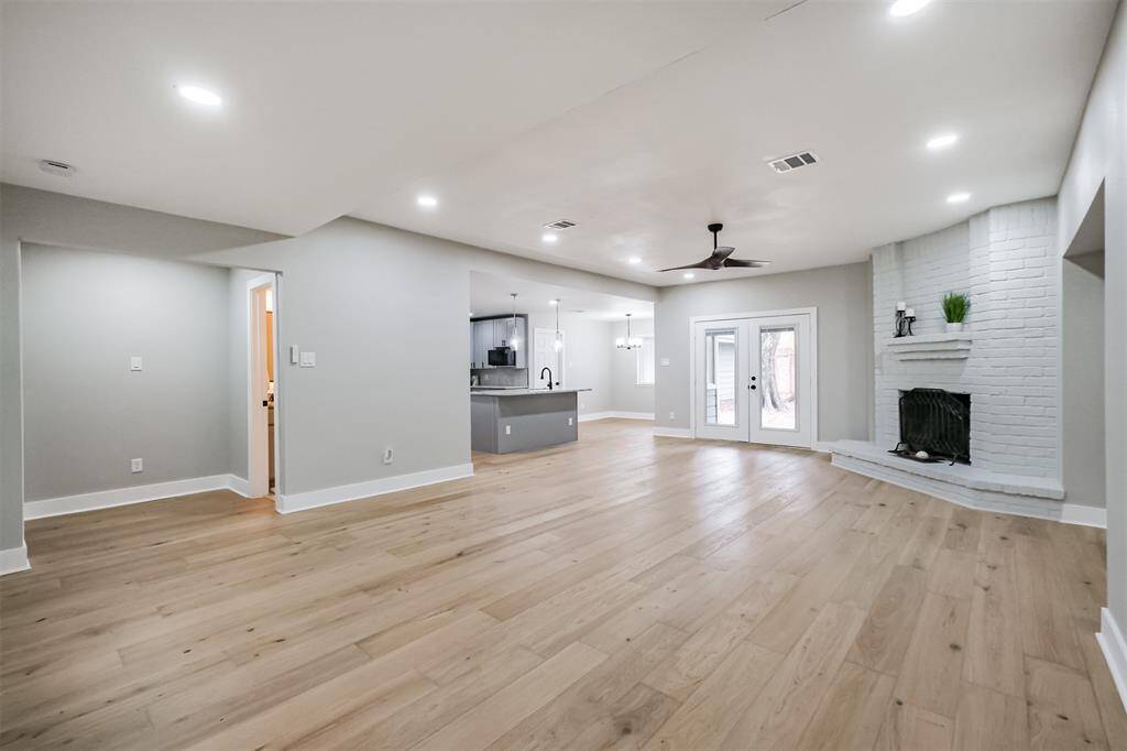 To the left of the front doors is a powder room and flexible room that will suit any family's needs.