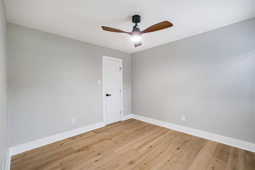 The first of two bedrooms has a window overlooking the front porch. A step-in closet is just across the room.