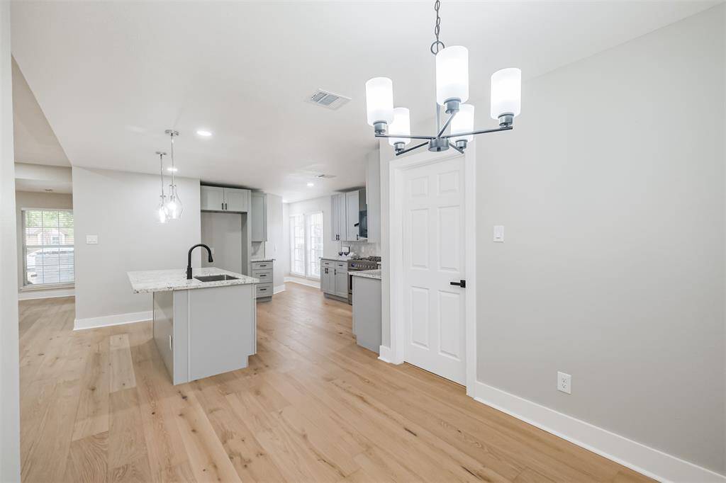 The laundry room is just to the right of the dining area.
