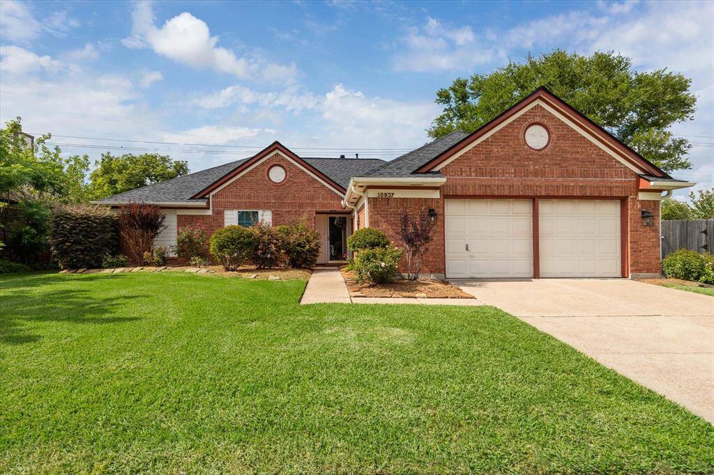 This single-story brick home features a well-maintained lawn, mature landscaping, and a two-car garage. Perfect for those seeking comfort and curb appeal.