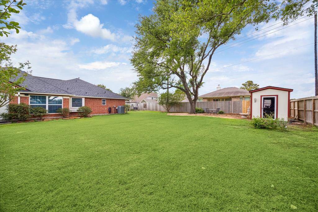 Almost a 1/2 acre corner lot could  include a playset, pool or both! The shed has power!