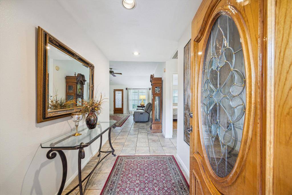A welcoming foyer, transitioning into a living room with natural light.