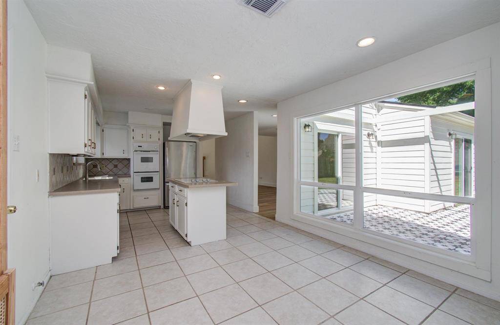 You large kitchen sink overlooks the front of the home.