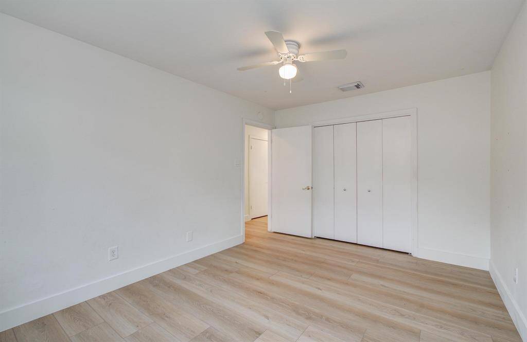 One of two large secondary bedrooms in this beautiful home. Closet has built in drawers.