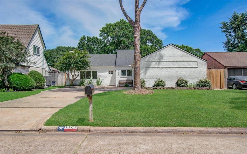 The exterior was painted for a more modern look with beautiful trees and landscaping.