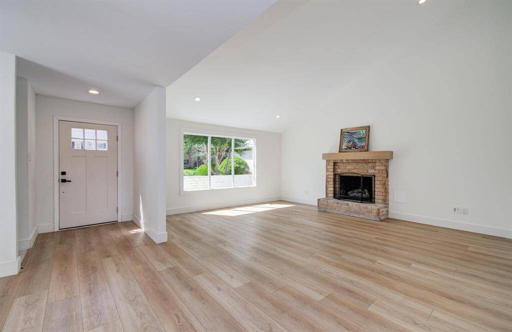 Virtually staged* Showing the versatility of this layout with the living and dining room.