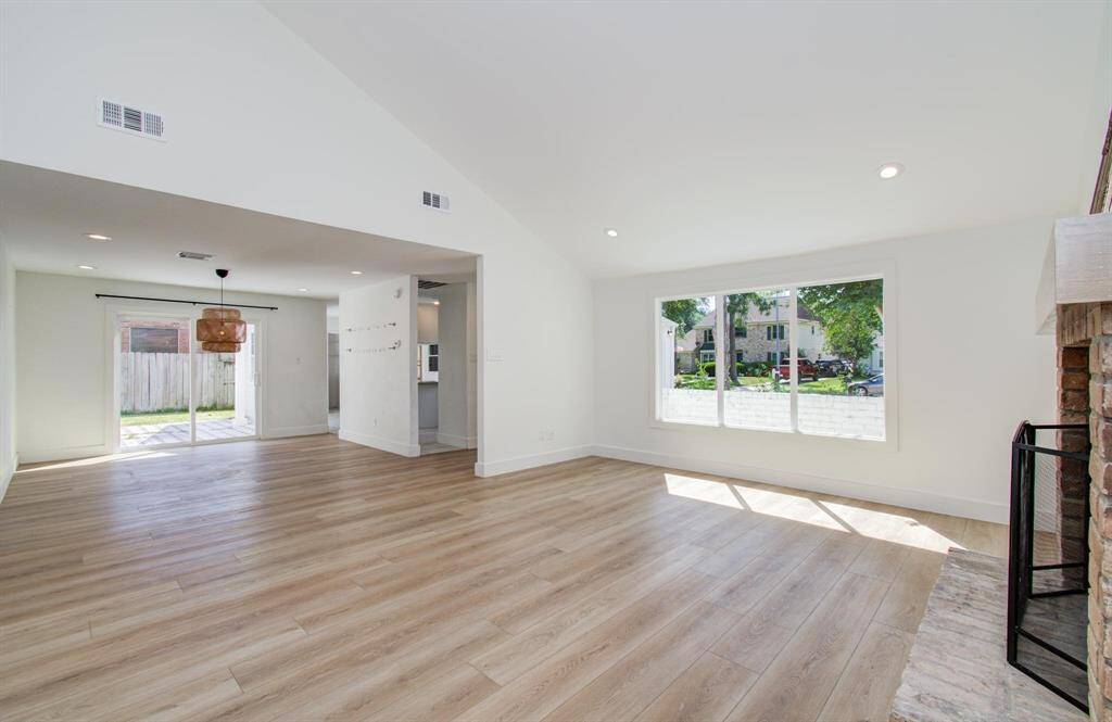Living room with easy open flow to the dining and kitchen.
