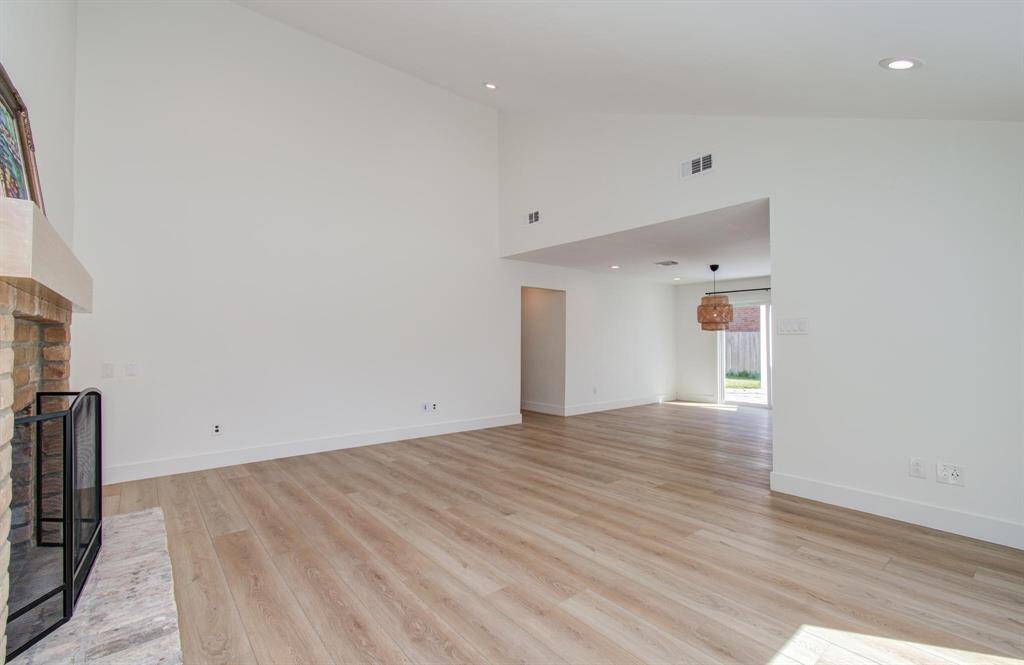 Enter to beautiful light luxury vinyl flooring and high ceilings in the large living space.