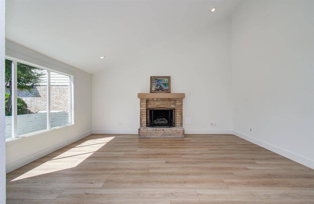 So much space to gather in the family room, with tons of natural light, fresh paint and high ceilings!