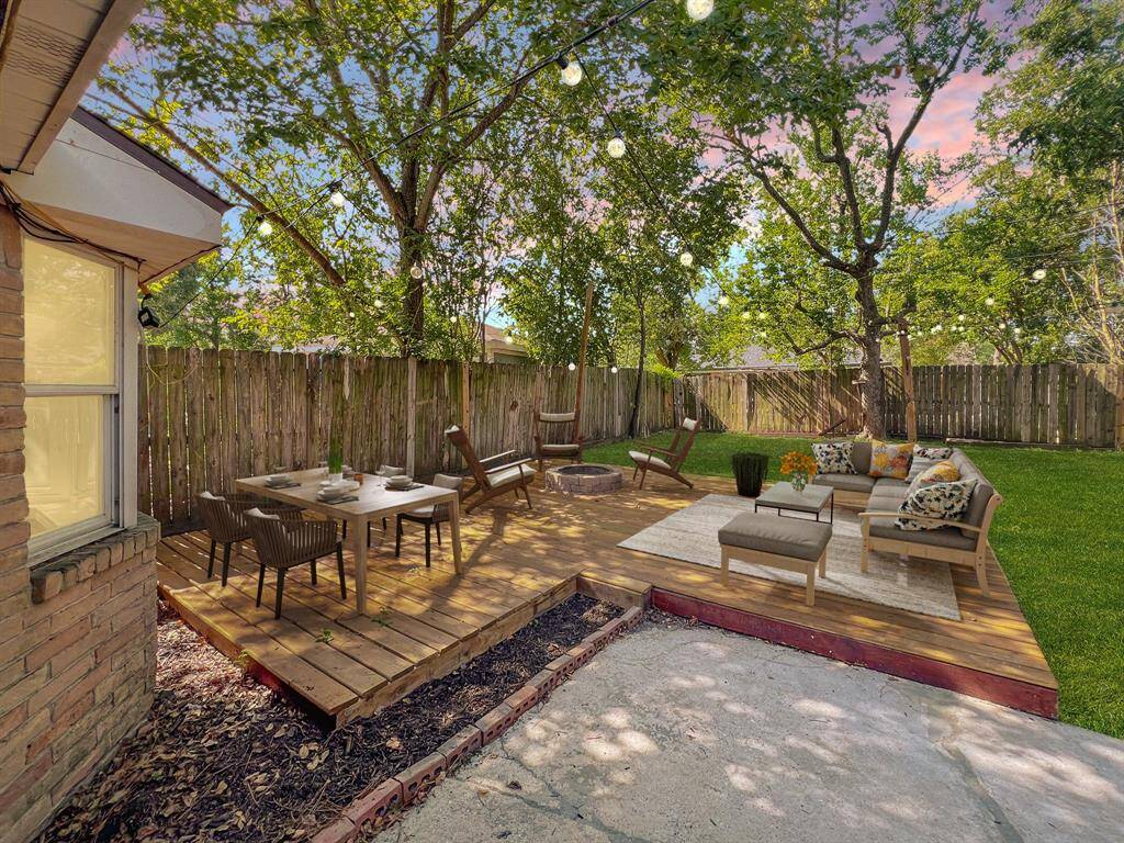 Outside patio with fireplace and lights - Virtually Staged