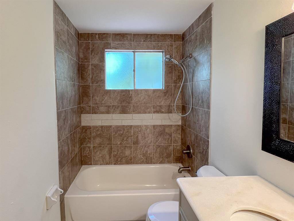 Guest bath upstairs with new tile that goes up to the ceiling
