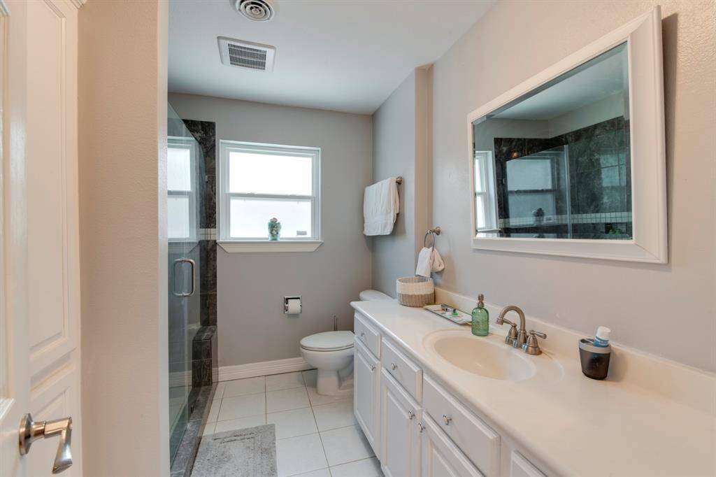 Easy access to bathroom with walk in shower.