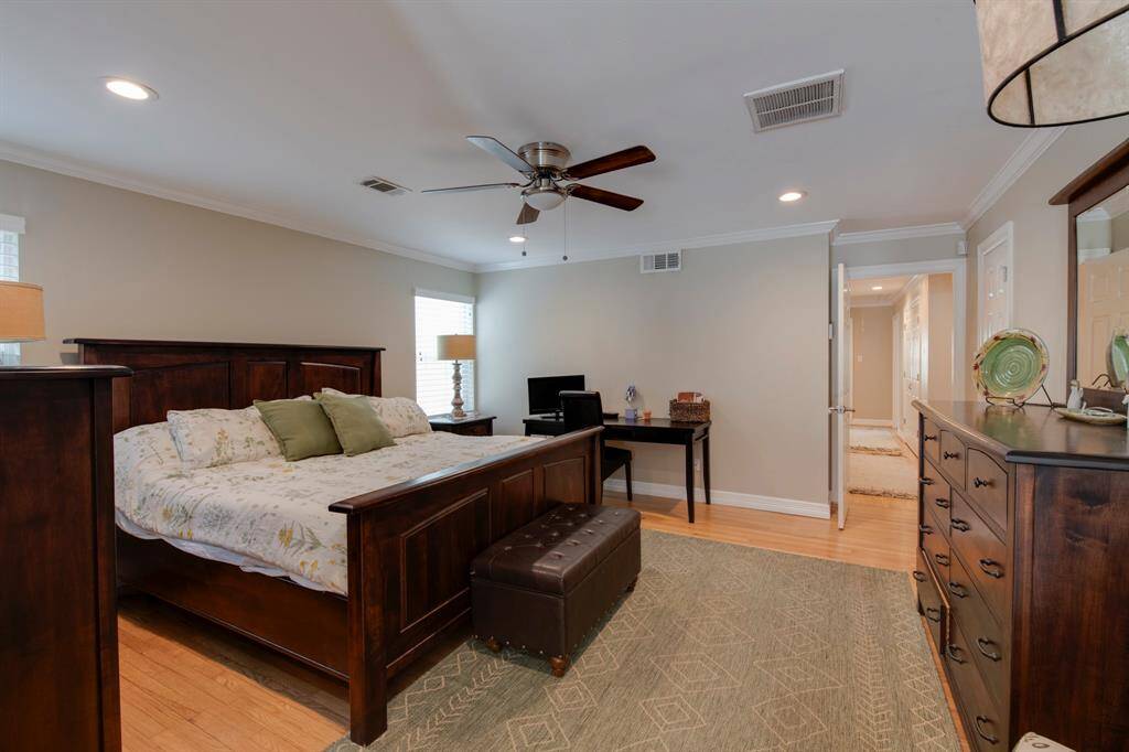 The primary room is spacious and has a lot of light. Extra bonus closet as you enter the room. Also  hallway leads to the other 2 bedrooms and a large hall closet!