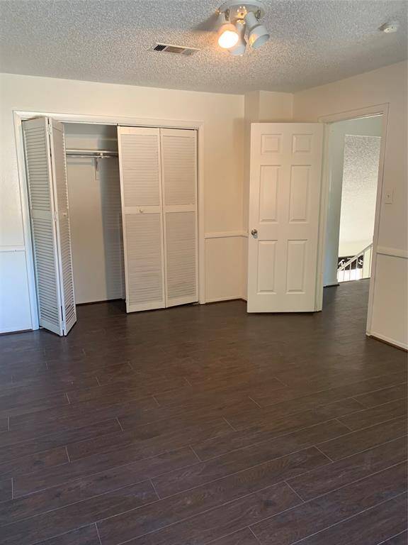 Secondary bedroom #3 additional view upstairs. Wood flooring throughout home!