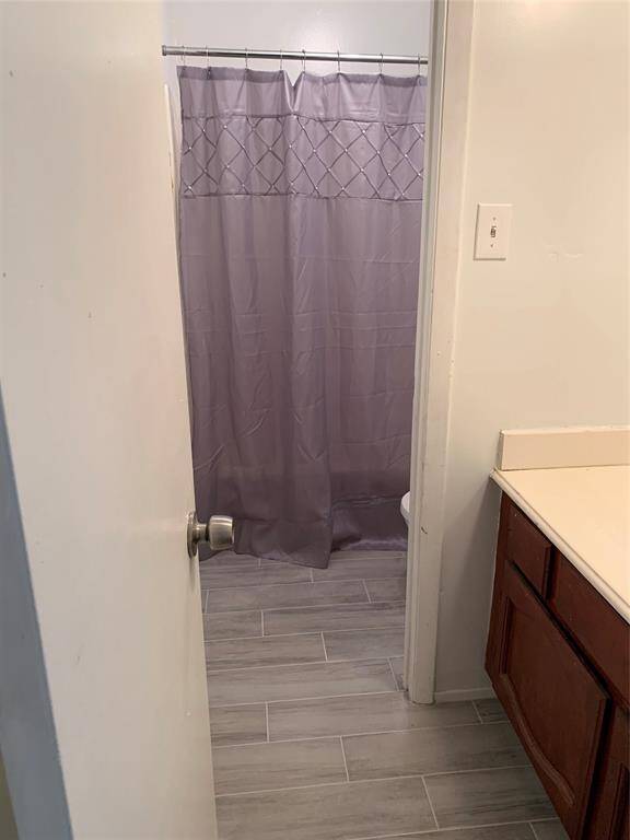 Full bath upstairs. Secondary bedroom #2 additional view upstairs. Wood flooring throughout home!