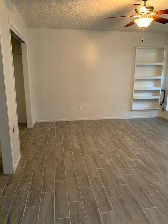 Primary Bedroom with good size closet. Wood flooring throughout home!