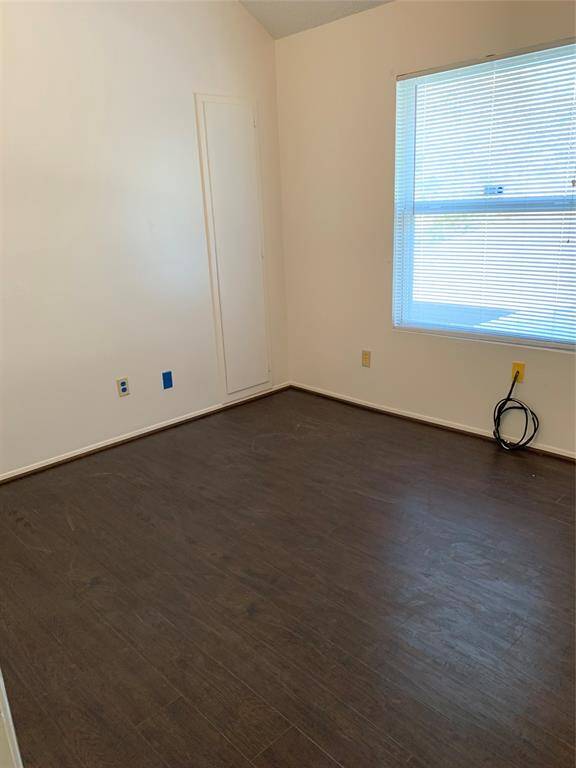 Secondary bedroom #1 upstairs. Wood flooring throughout home!