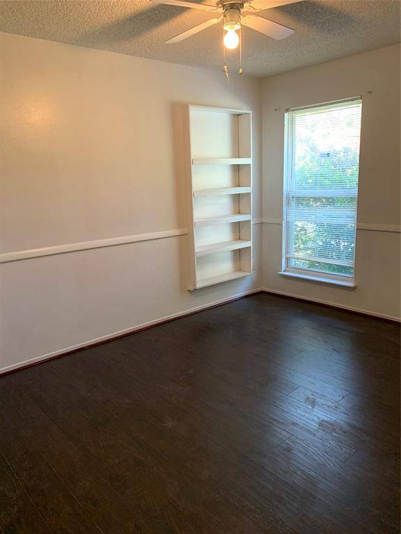 Secondary bedroom #2 upstairs. Wood flooring throughout home!