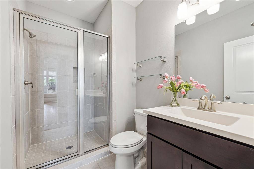 The second floor full bath with a tiled walk-in shower—is conveniently separate, making it perfect for guests when entertaining.